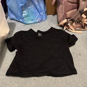 Jockey cropped black tee